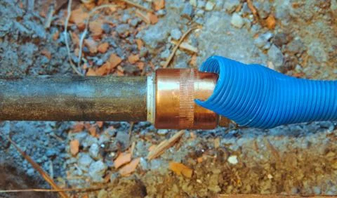 Cold water pipe on broken floor Stock Photos