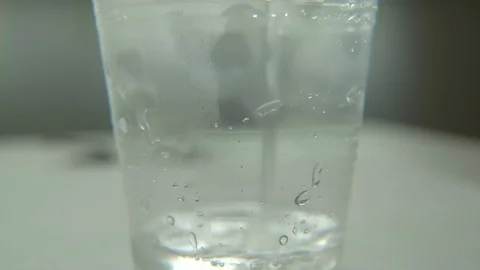 Cold water in the plastic glass Stock Footage 114801548