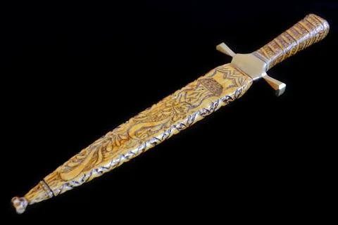 Cold weapon on black background Stock Photos