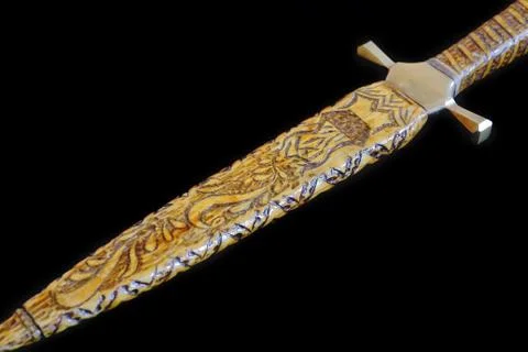 Cold weapon on black background Stock Photos