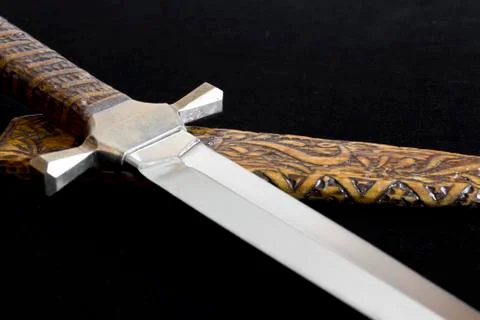 Cold weapon on black background Stock Photos