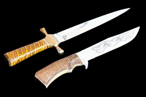 Cold weapon on black background Stock Photos