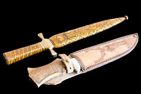 Cold weapon on black background Stock Photos