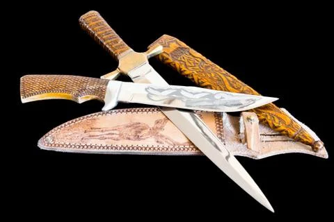 Cold weapon on black background Stock Photos