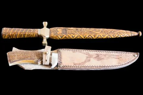 Cold weapon on black background Stock Photos