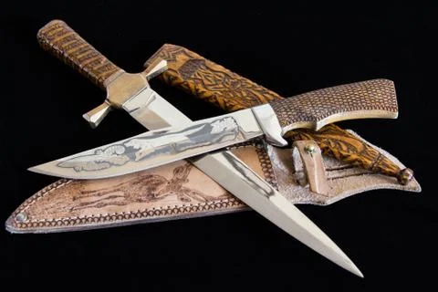 Cold weapon on black background Stock Photos