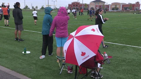 Cold wet rain high wind at college university ultimate frisbee sports event Stock Footage 40896291