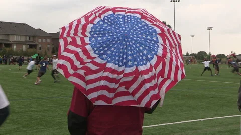 Cold wet rain high wind at college university ultimate frisbee sports event Stock Footage 40896460