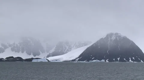 A cold wind whips across a freezing Antarctic sea Stock Footage 34313383