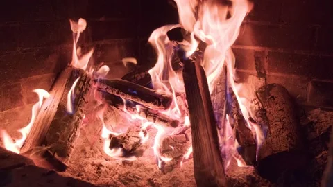 Cold winter and heating the house with firewood and coal in the fireplace Stock Footage 201957241