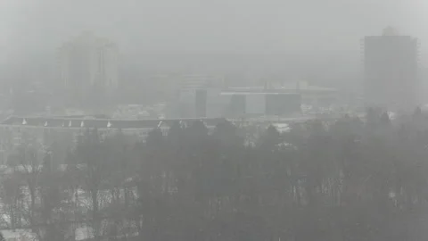 Cold winter day on college campus with snow falling in the city Stock Footage 168089272