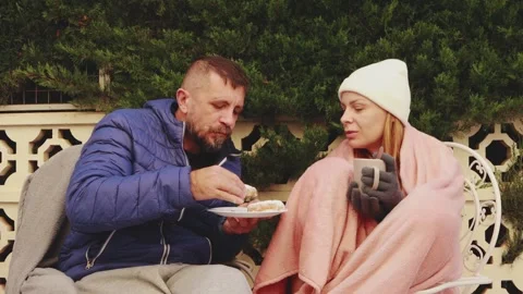 Cold winter day: impoverished couple sharing cake, drinking hot beverage, h.. Stock Footage 301646382
