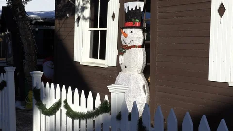 Cold winter day on small town main street with people and Christmas decorations Stock Footage 119936656
