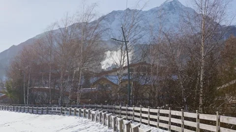 Cold winter day in small town or village in Austria during snow ski season Stock Footage 319066433