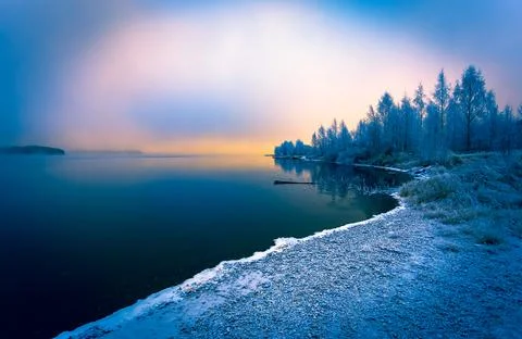 Cold winter day sunset landscape with snowy trees Photo from Sotkamo Finland Stock Photos
