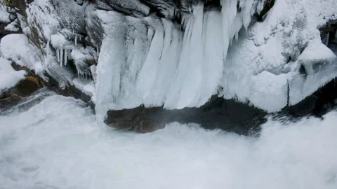 Cold Winter Nature Background with Icicles Above Waterfall Stock Footage 304963439