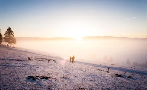 Cold winter sunset with people Stock Photos