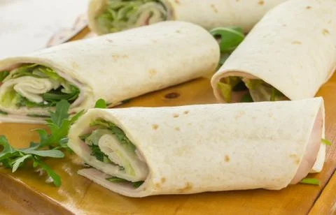 Cold wraps filled with ham and iceberg lettuce Foto stock