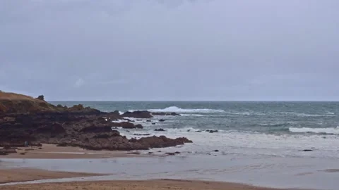 Coldingham Bay beach in winter rocks and waves Stock Footage 234569063