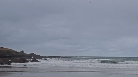 Coldingham Bay beach in winter rocks and waves Stock Footage 235928020