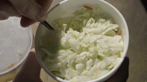 Cole slaw scoop takeout container close up Stock Footage 294441453
