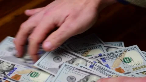 Colecting 100 bills Stock Footage 257939203