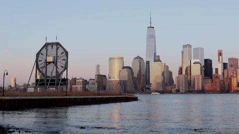 Colgate Clock and Lower Manhattan Skyline Sunset Stock Footage 105986812