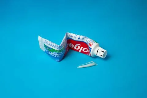 Colgate toothpaste has died. Fun and minimal color still life photography Stock Photos