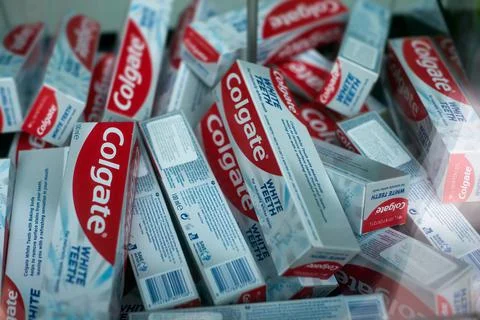 Colgate toothpaste pile in a store showroom Stock Photos