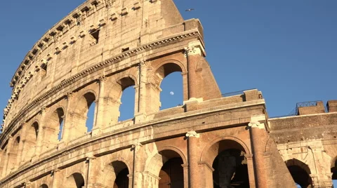 The Coliseum in Rome: zoom in with the moon between the arches Stock Footage 62874296