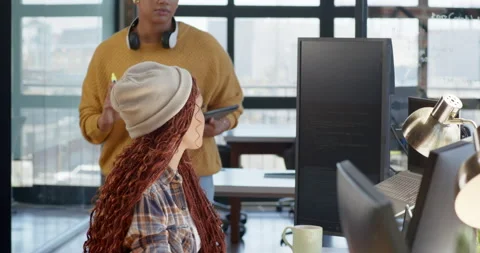 Collaborating on coding project, diverse female team using computer and Stock Footage 311495470