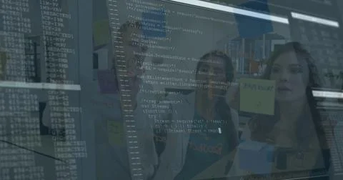 Collaborating colleagues reviewing code on glass board with sticky notes in 스톡 사진