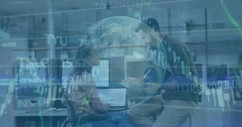 Collaborating data analysts reviewing binary streams in open-plan office, with Foto stock