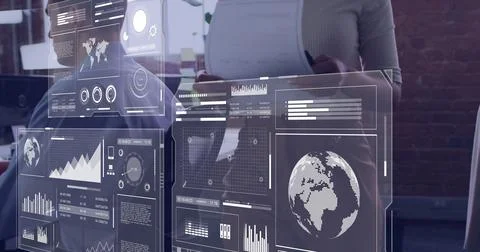 Collaborating data team interacting with interface panels in modern office, Fotos de archivo