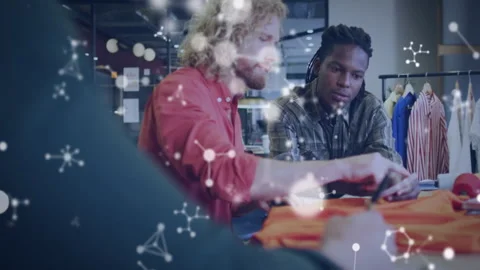 Collaborating designers creating fabric patterns with molecular structure Stock Footage 306226857