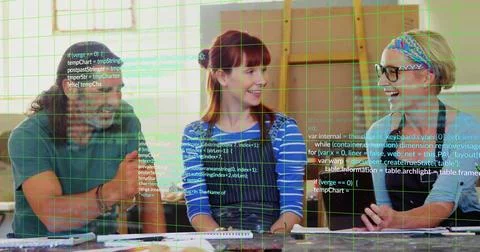 Collaborating developers discussing code and sketches in workshop, with pens, 스톡 사진