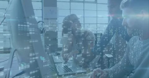 Collaborating developers discussing code on laptop, monitor in modern office, 库存照片