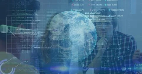 Collaborating developers typing code at office desk, with monitors, keyboard and Stockfoto's