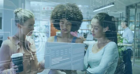 Collaborating with digital data interfaces, diverse group in modern office Stock Footage 326761959