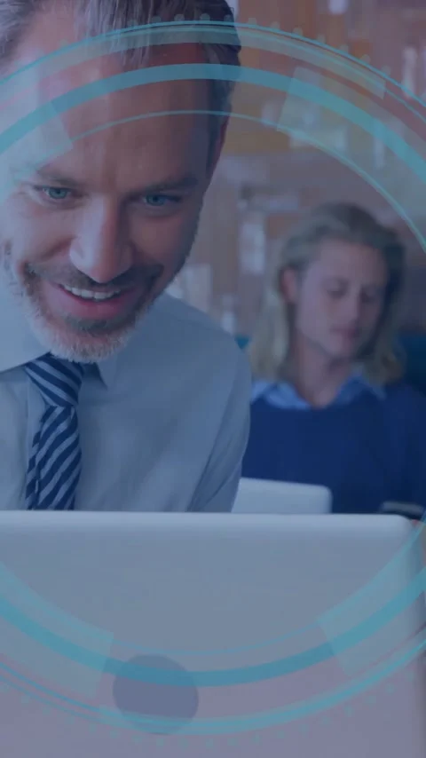 Collaborating on laptop, business professionals analyzing digital data in office Stock Footage 344370421