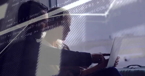 Collaborating on laptop, business professionals with coding animation overlay in Stock Footage 304011378
