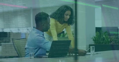 Collaborating on laptop, colleagues working with coding animation in office Stock Footage 326189411