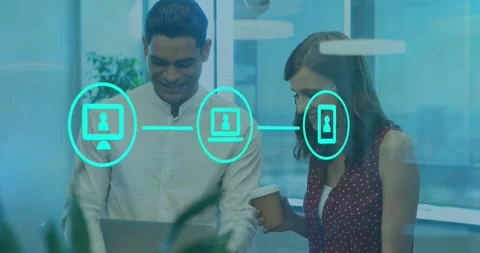 Collaborating on laptop, two colleagues with digital network animation in office Stock Footage 330288260