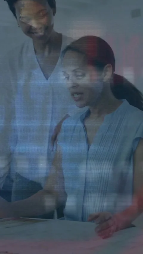 Collaborating in office, diverse team processing financial data with animation Stock Footage 319811626
