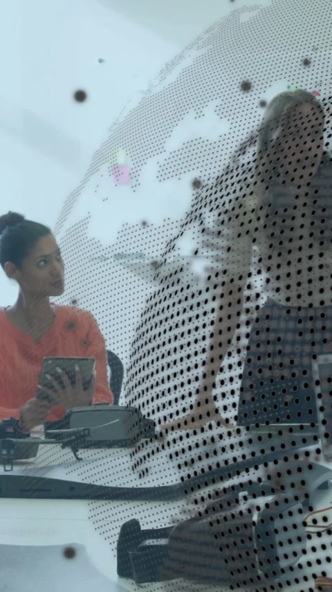 Collaborating in office, diverse team using animation with digital globe and Stock Footage 344370317