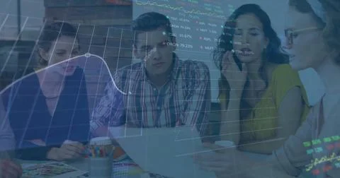 Collaborating professionals studying stock chart overlay at office meeting, with Stock Photos