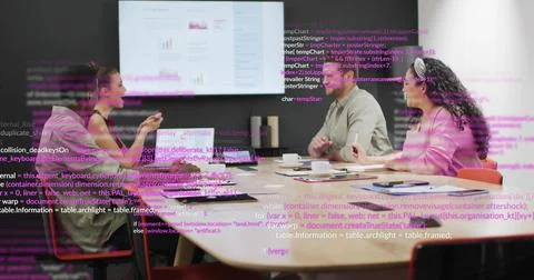 Collaborating software team analyzing charts on monitor in office with laptop Stock Photos