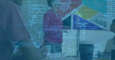 Collaborating team analyzing code and data on laptops in open-plan office, 写真素材