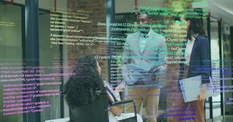Collaborating team in blazers projecting code snippets in office hallway with Stock Photos