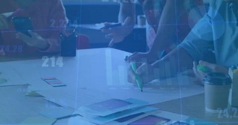 Collaborating team members annotating app mockups in meeting room, with smart Stock Photos